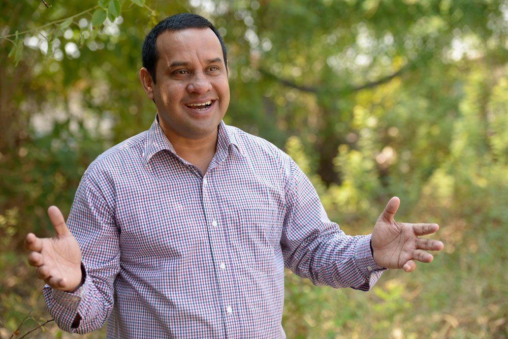 portrait indian businessman with short hair relaxing park outdoors